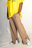 PANTALON HAUTE COUTURE EN POLYESTER IMPRIMÉ LOGO CREKMONGA PARIS, DEUX FENTES