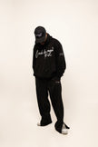 PANTALON HAUTE COUTURE EN POLYESTER IMPRIMÉ LOGO CREKMONGA PARIS, UNE FENTE