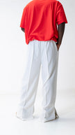 PANTALON HAUTE COUTURE EN POLYESTER IMPRIMÉ LOGO CREKMONGA PARIS, DEUX FENTES